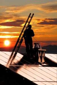 Chimney sweeping during a fall sunset Chimney sweeping during a fall sunset