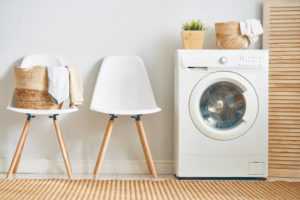 Dryer Vent Safety - Kansas City MO - Sleep Easy Chimney Service white chairs next to white clothing dryer on wooden floor