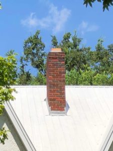 Spalling Brickwork - Kansas City MO - Sleep Easy Chimney red chimney on white roof