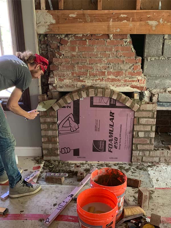 Sleep Easy Chimney Service- Original of Fireplace Remodel Technician building fireplace