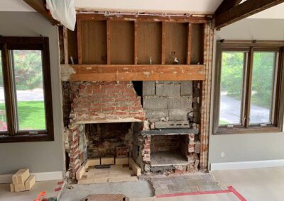 red brick fireplace being built