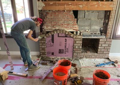 Technician building fireplace