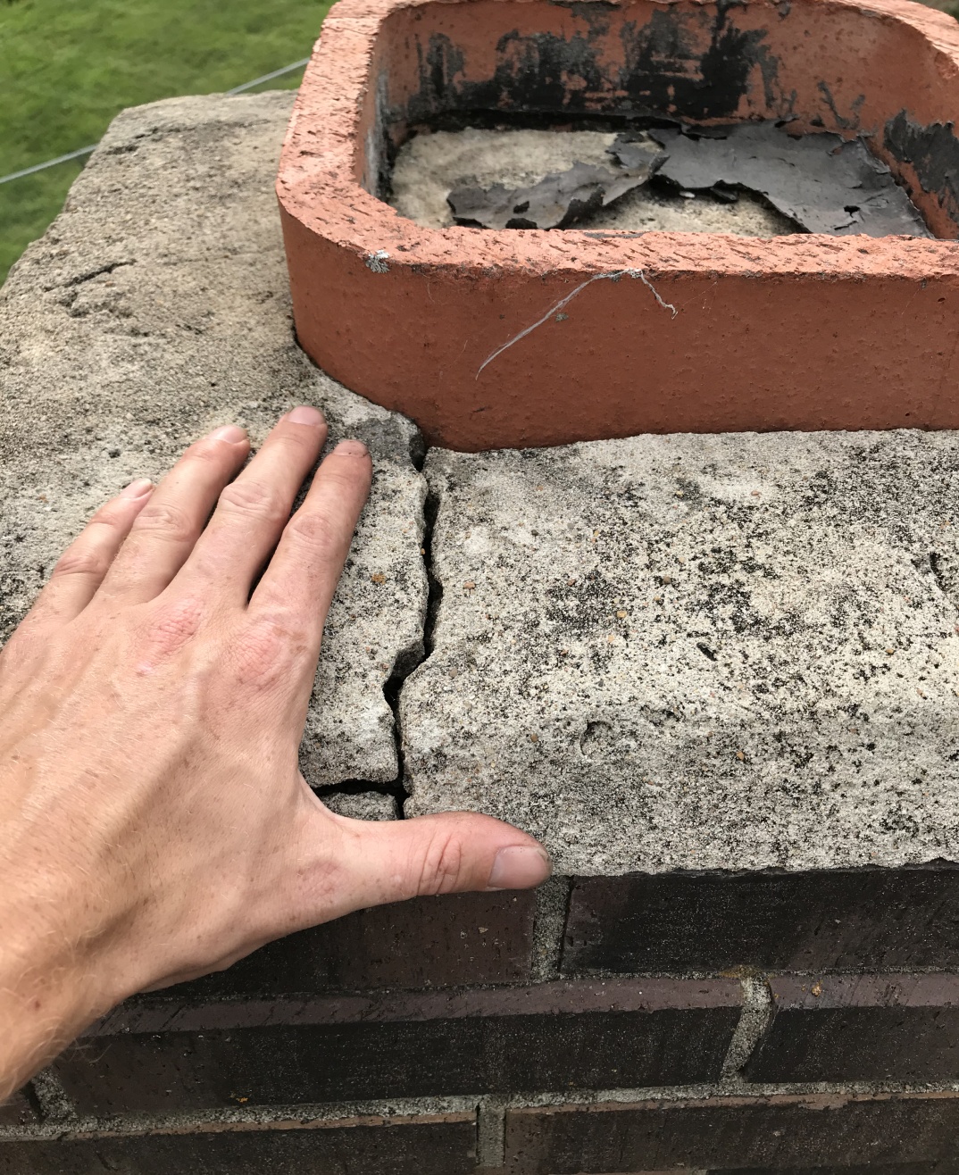 cracked chimney crown tall chimney photo